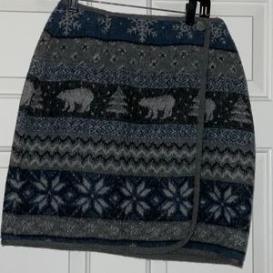 Wrap around skirt with cute design. Size 8 and   Length is 19 in.
